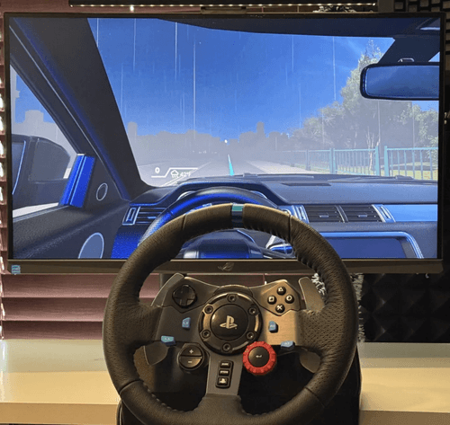 First experiment setup with steering wheel and video simulation